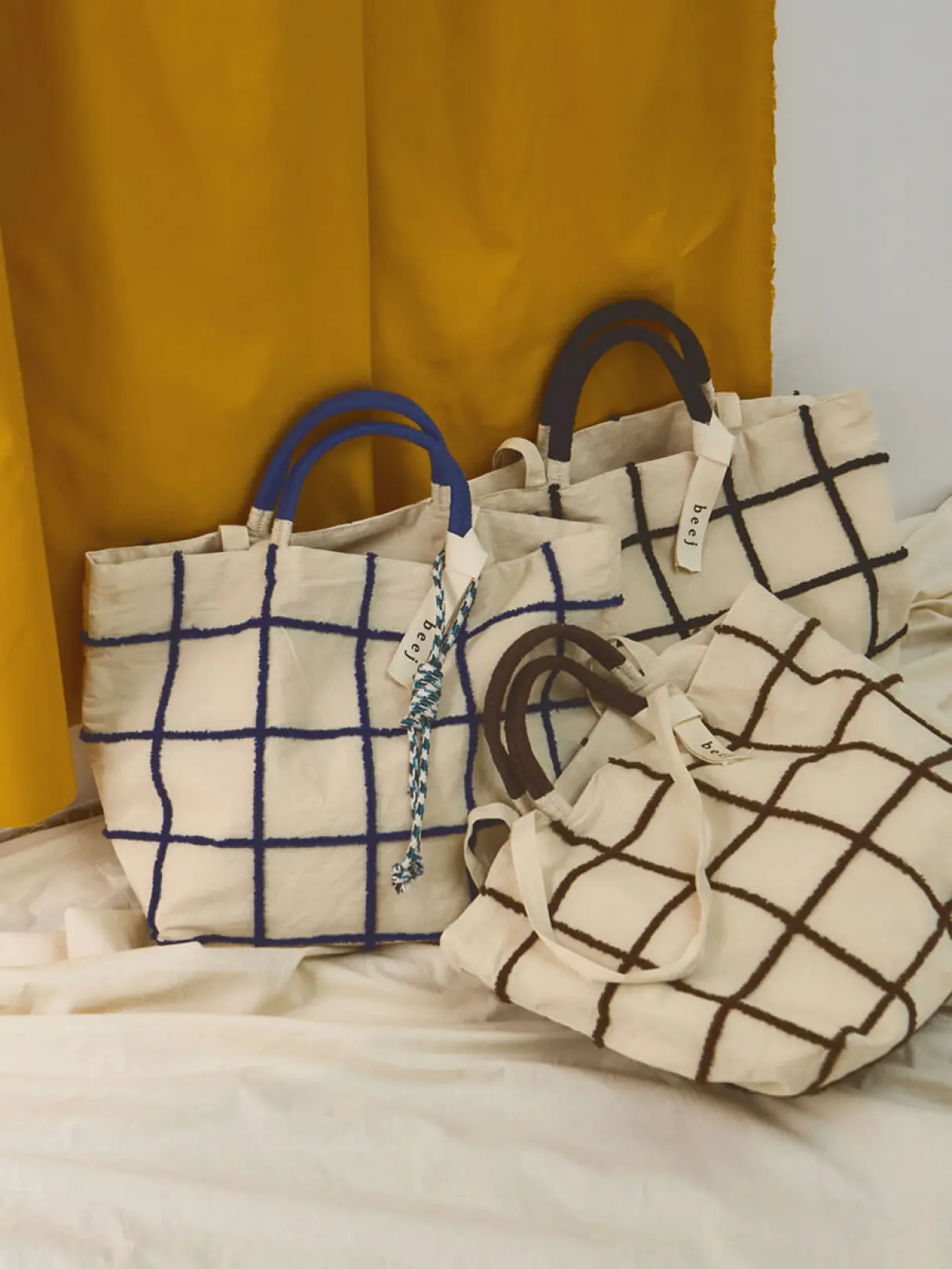 Loop embroidered check bag