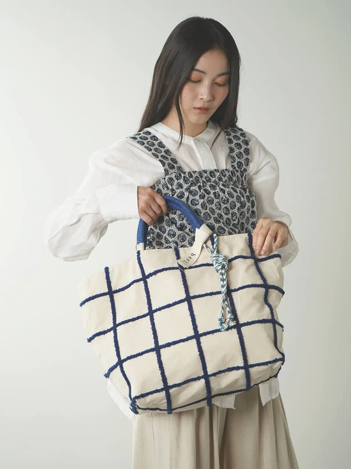 Loop embroidered check bag