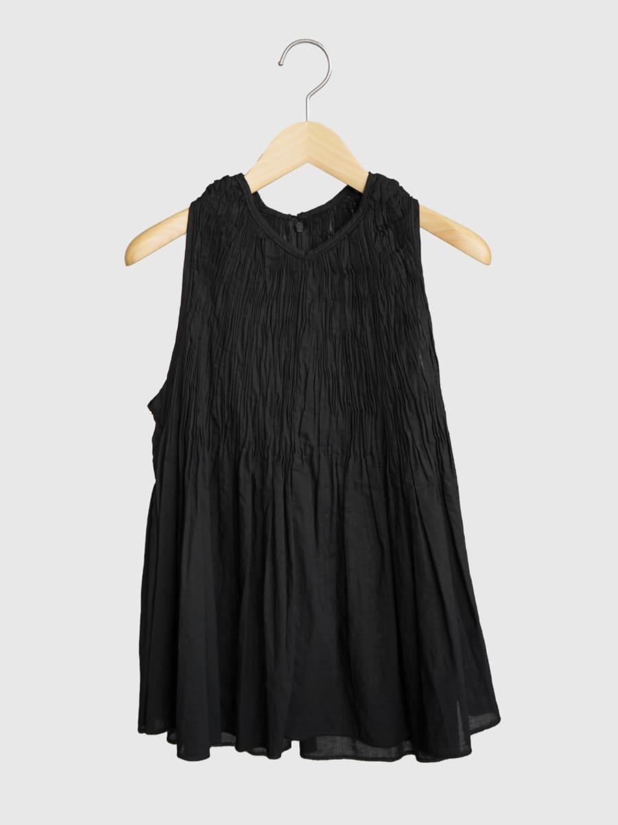 Tucked sleeveless blouse